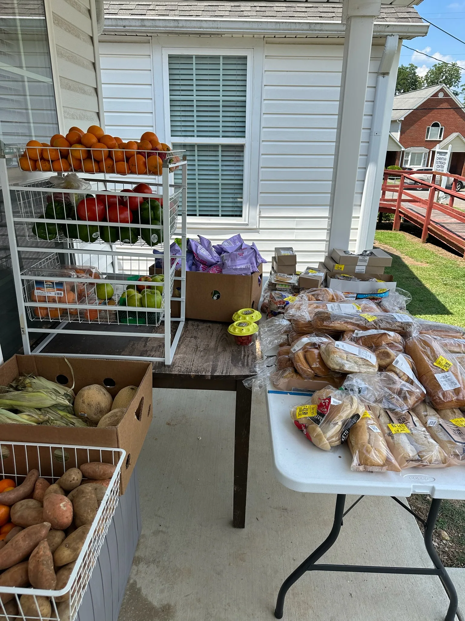 Fresh produce and bread set out for food distribution